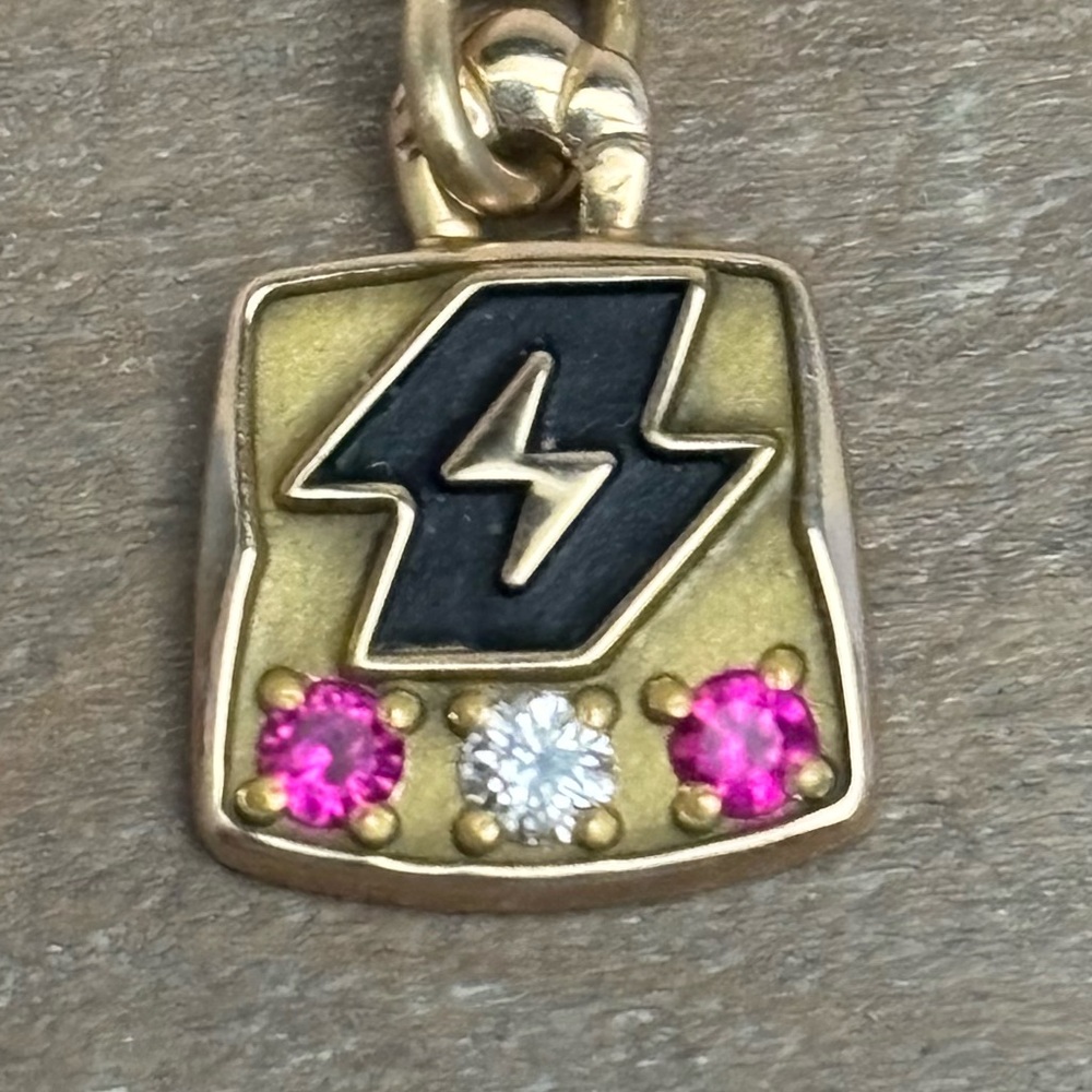 10K gold lighting bolt pendant with rubies and diamond and 12K gold necklace